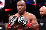 ARLINGTON, TEXAS - NOVEMBER 15: Mike Tyson fights during LIVE On Netflix: Jake Paul vs. Mike Tyson at AT&amp;T Stadium on November 15, 2024 in Arlington, Texas. (Photo by Al Bello/Getty Images for Netflix © 2024)